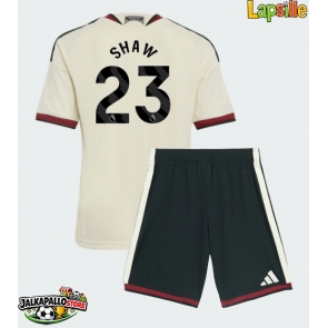 Manchester United Luke Shaw #23 Kolmaspaita Lapsille 2026-27 Lyhythihainen (+ shortsit)